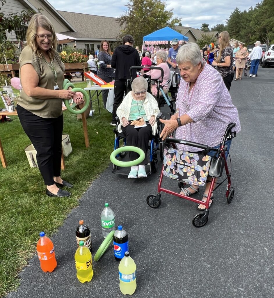 Residents playing a ring toss game