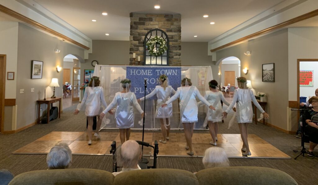 Residents enjoying a dance performance