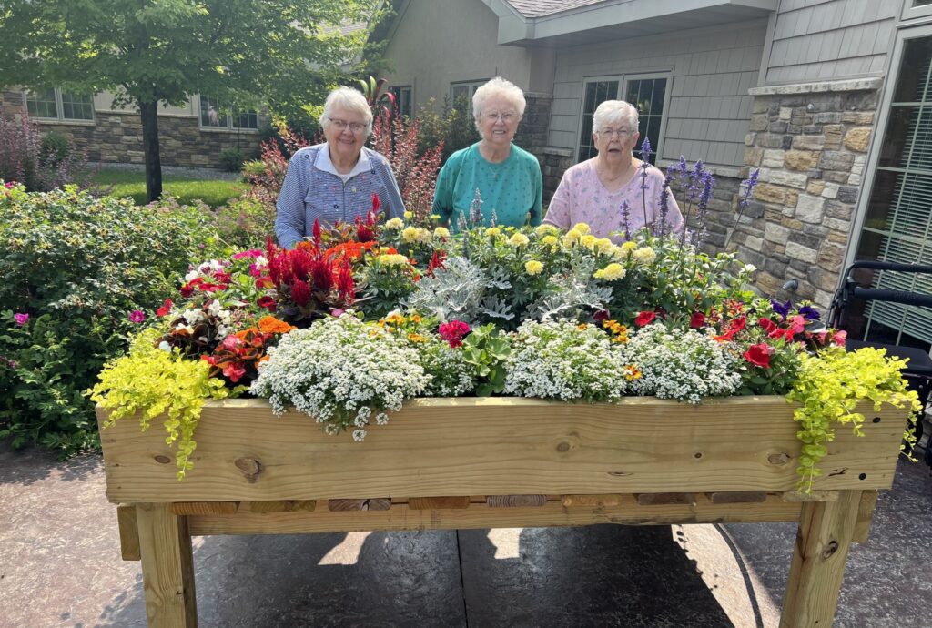 Residents outside with large flowers